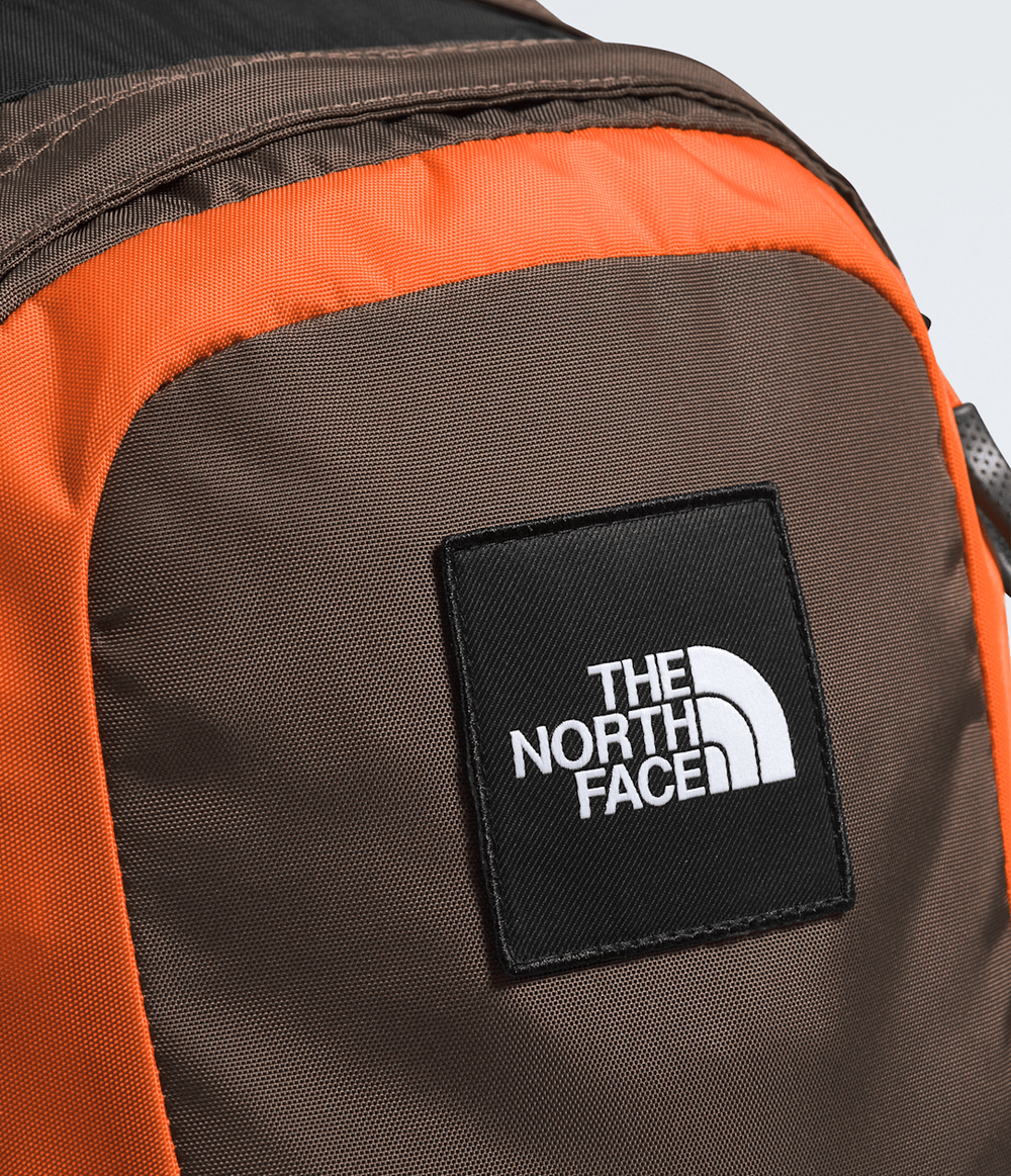 Hot Shot SE Backpack - Smokey Brown/TNF Black/Solar Flare
